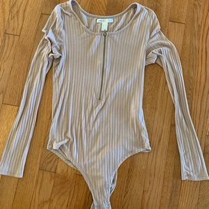 Off white body suit with zip up